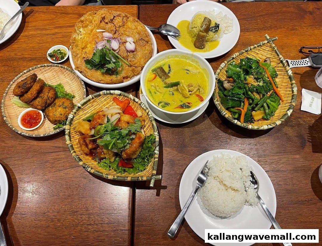 A vibrant spread of authentic Thai dishes, including curry, fish cakes, and stir-fried vegetables.