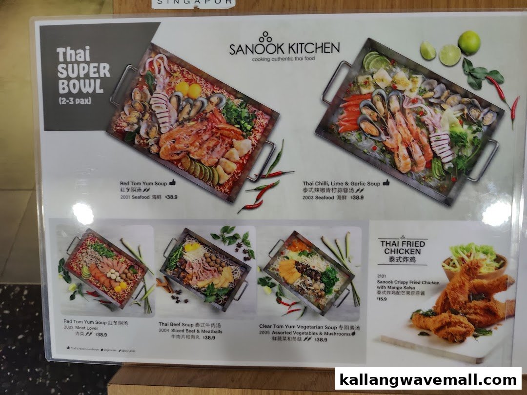 A vibrant menu board showcasing Sanook Kitchen's Thai Super Bowls and Fried Chicken dishes.