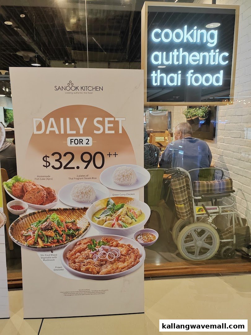 A promotional stand for Sanook Kitchen's Daily Set for 2, featuring various Thai dishes and pricing.
