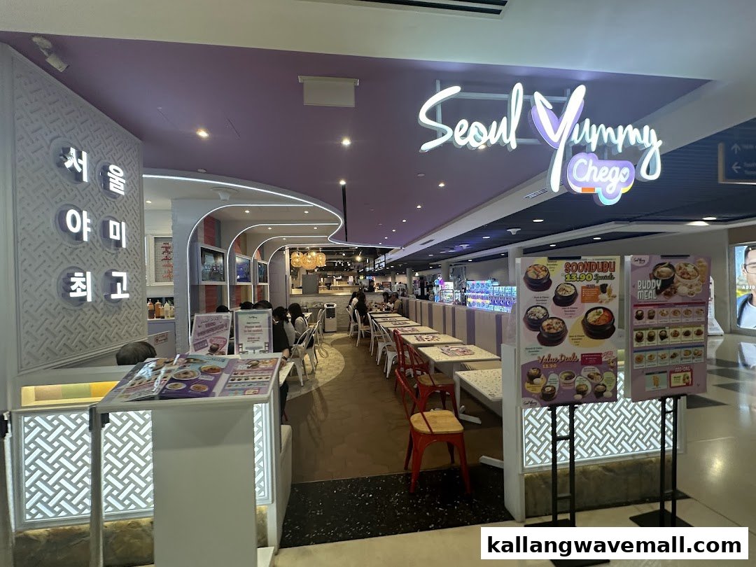 The vibrant entrance of Seoul Yummy Chego, a Korean restaurant, with inviting seating and promotional displays.