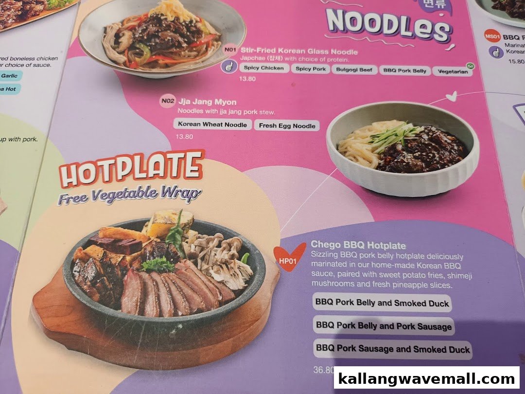A vibrant menu page showcasing Korean noodles and a sizzling hotplate from Seoul Yummy.