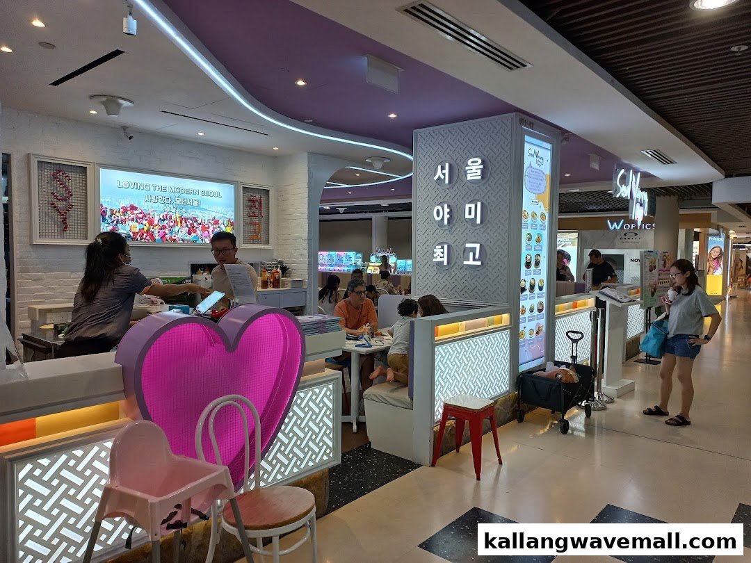 A vibrant interior shot of Seoul Yummy, showing customers dining and staff at the counter.