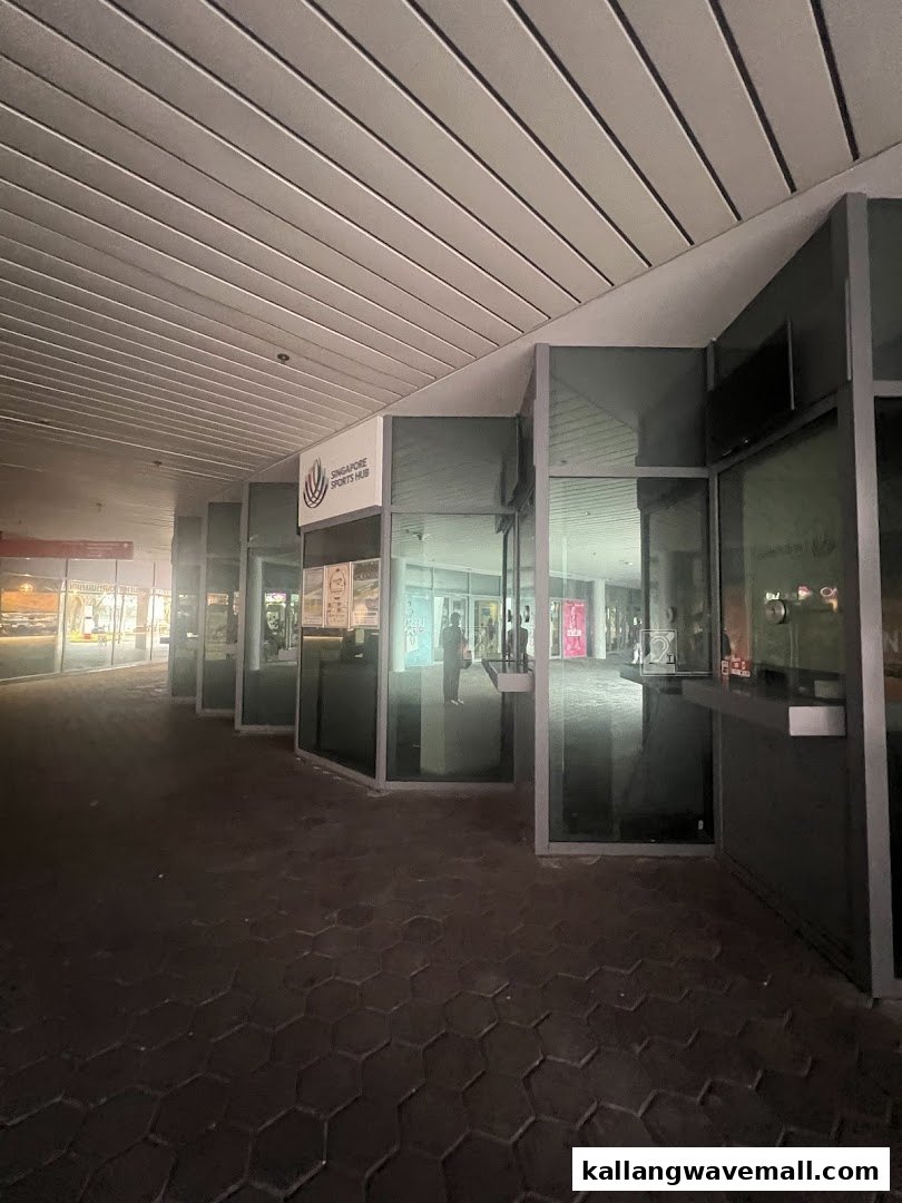Exterior view of the Singapore Sports Hub Box Office with multiple glass windows and a prominent sign.