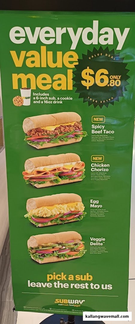 A vibrant green Subway menu board showcasing value meals and featured subs.