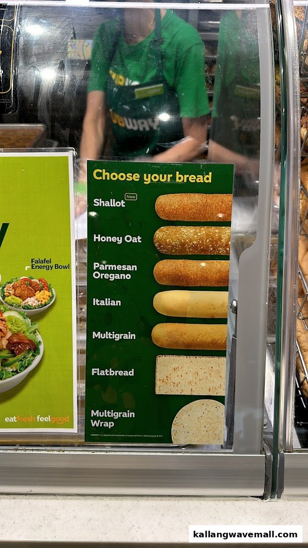 A display showcasing Subway's bread options and a Falafel Energy Bowl advertisement.