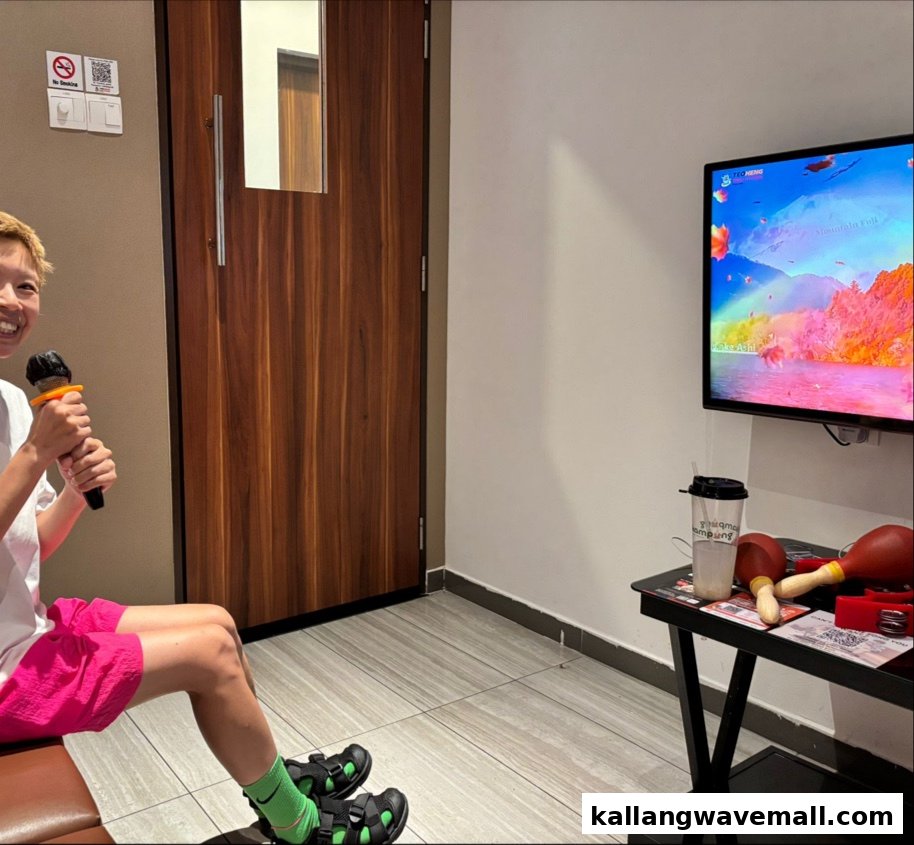 A person singing karaoke in a vibrant KTV room with a large screen and musical instruments.