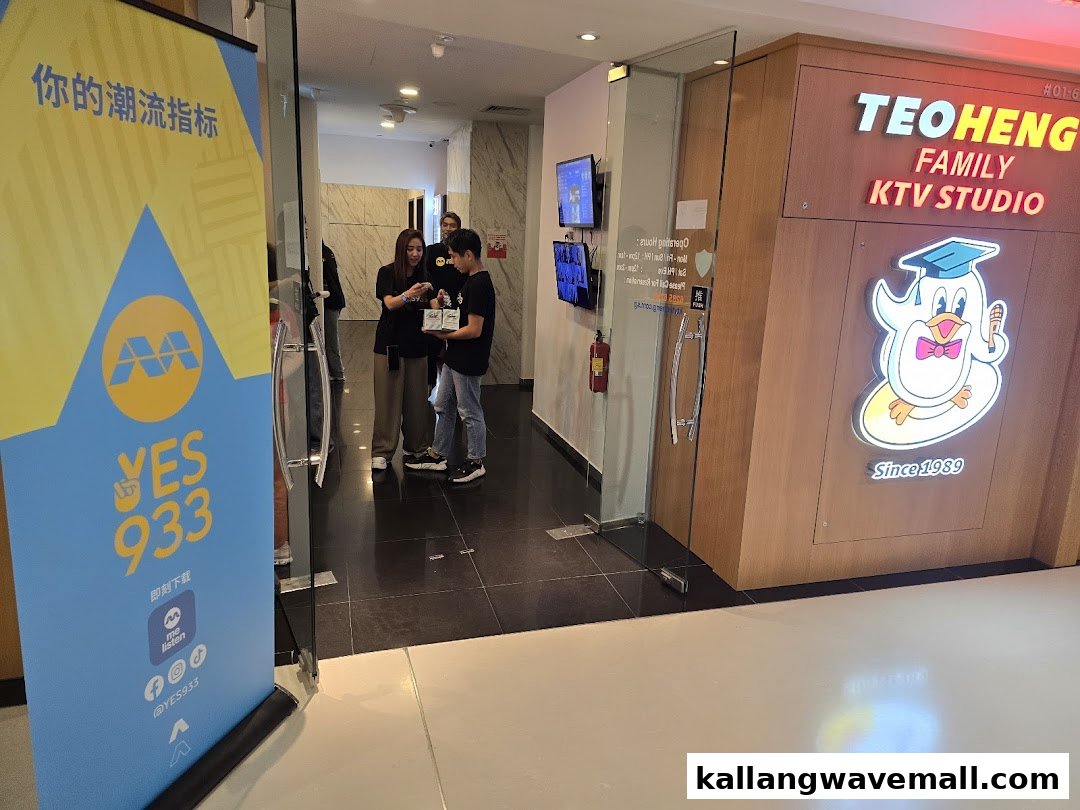 Entrance to Teo Heng KTV Studio with staff and a promotional banner.