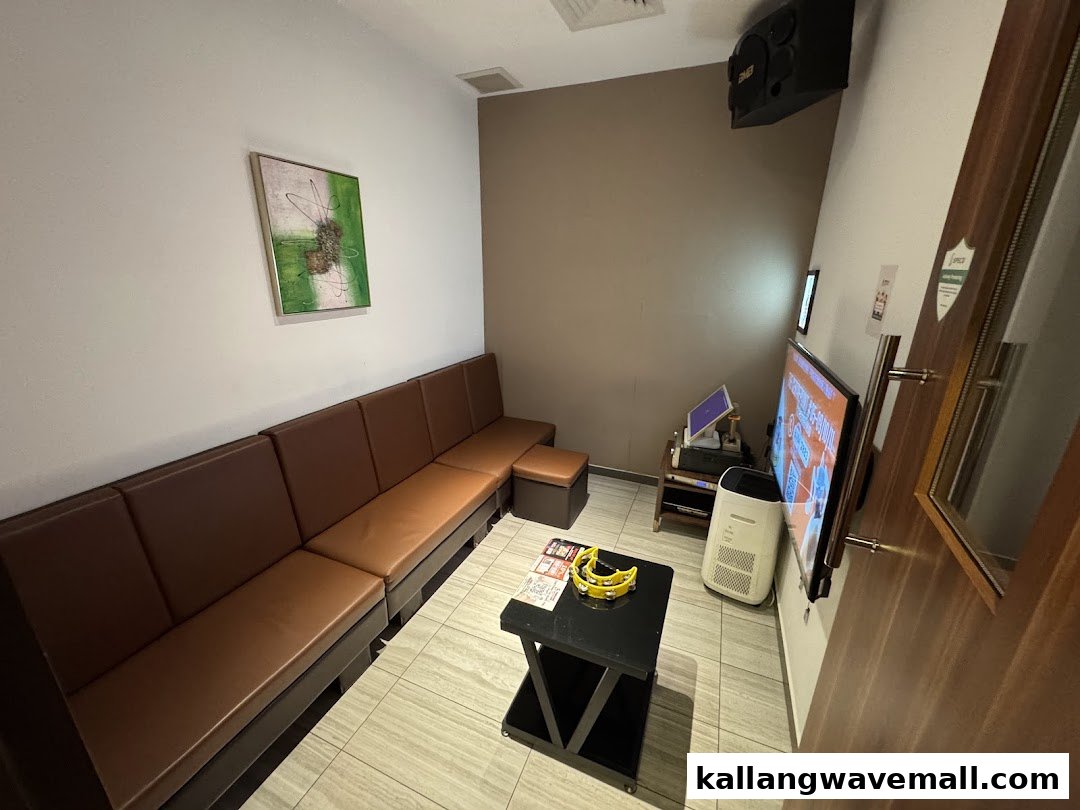 A cozy KTV room at Teo Heng KTV Studio with comfortable seating, TV, and karaoke setup.