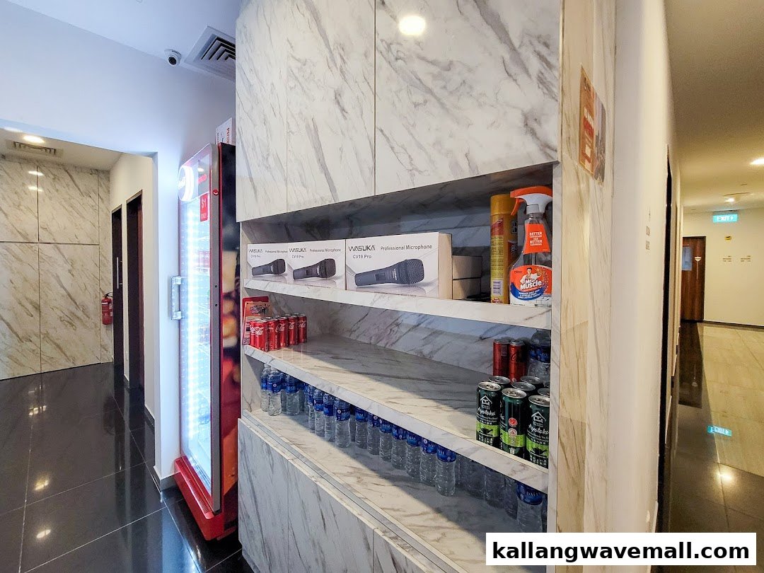 Interior view of Teo Heng KTV Studio hallway with vending machine and product display.