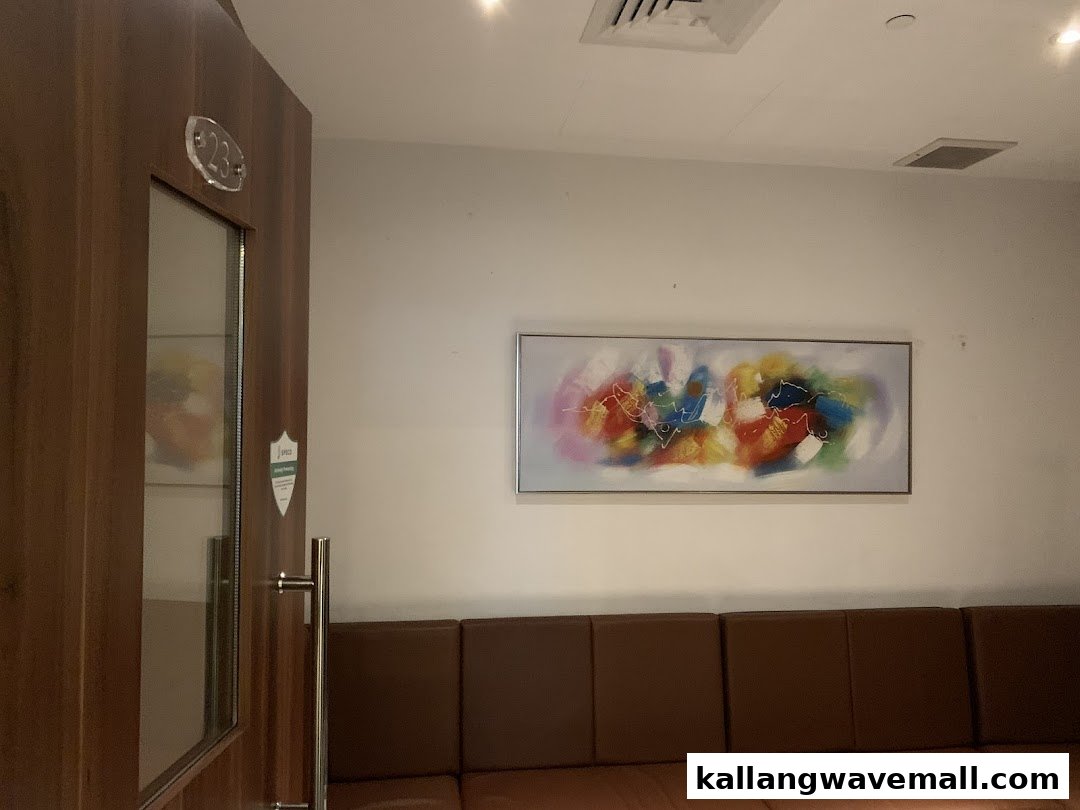 Interior of Teo Heng KTV Studio showing a waiting area with sofa and abstract art.