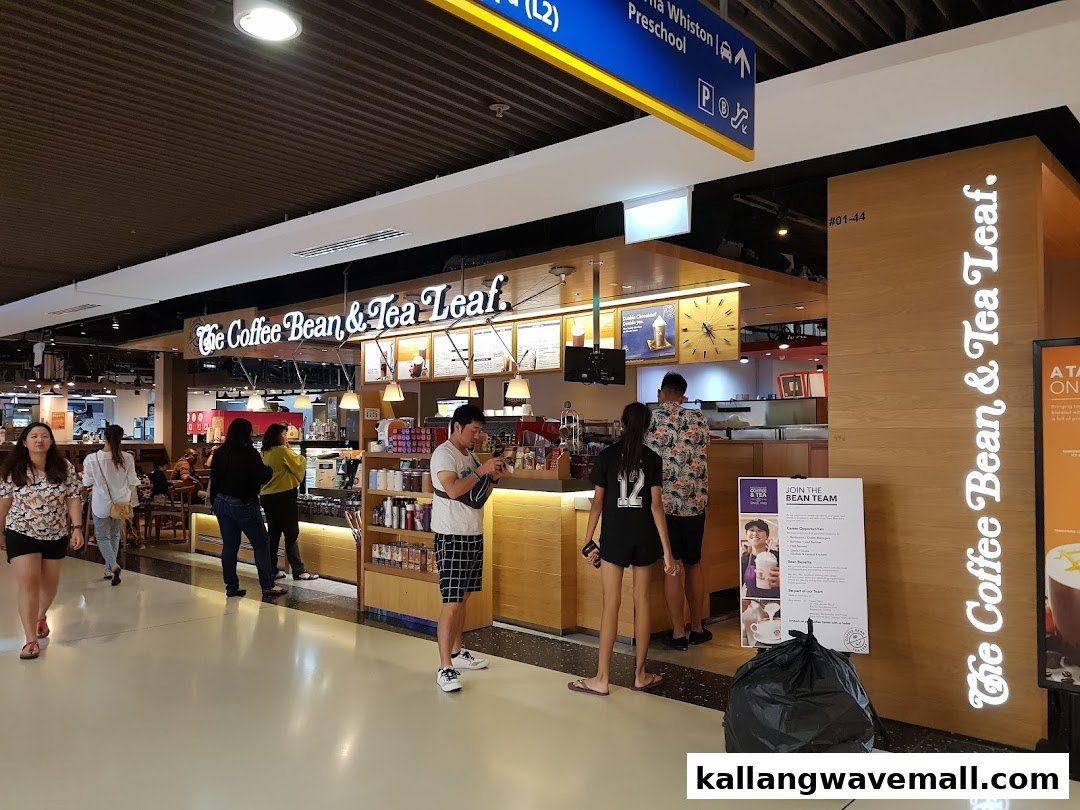 The Coffee Bean & Tea Leaf shop front in a mall, with customers and staff visible.
