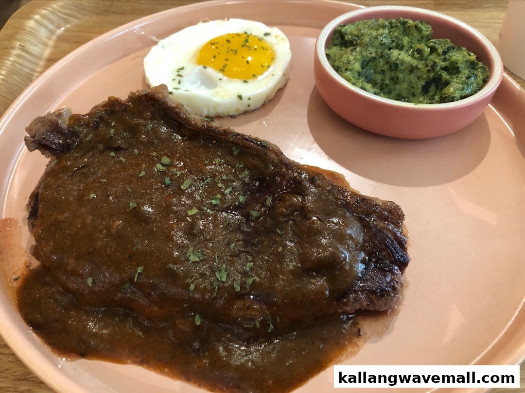 A plate featuring a steak with gravy, a fried egg, and a side of creamed spinach.