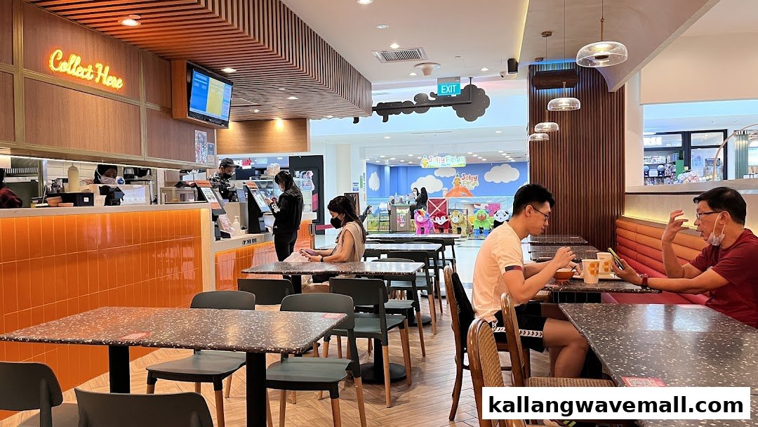Customers dining and staff working at the counter inside The Soup Spoon Union restaurant.
