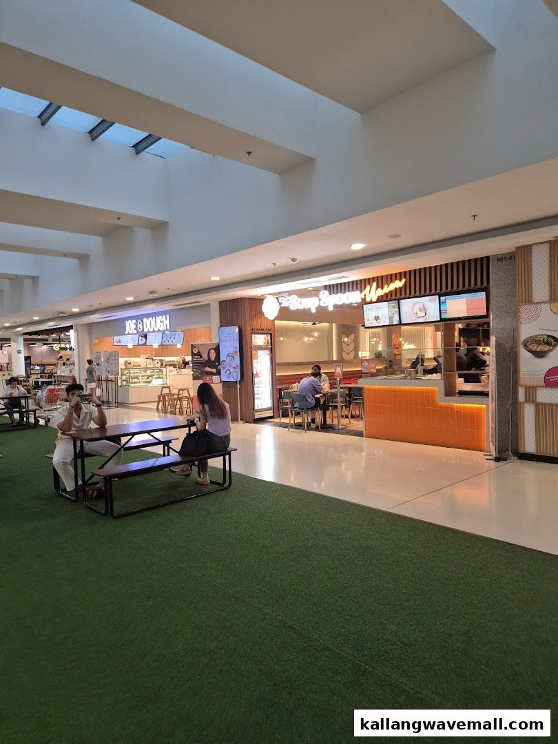 The shop front of The Soup Spoon Union and Joe & Dough in a mall, with indoor and outdoor seating.