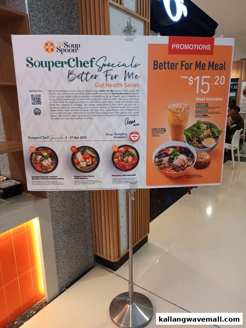 A promotional stand for The Soup Spoon Union, featuring 'SouperChef Specials' and a 'Better For Me Meal' promotion.