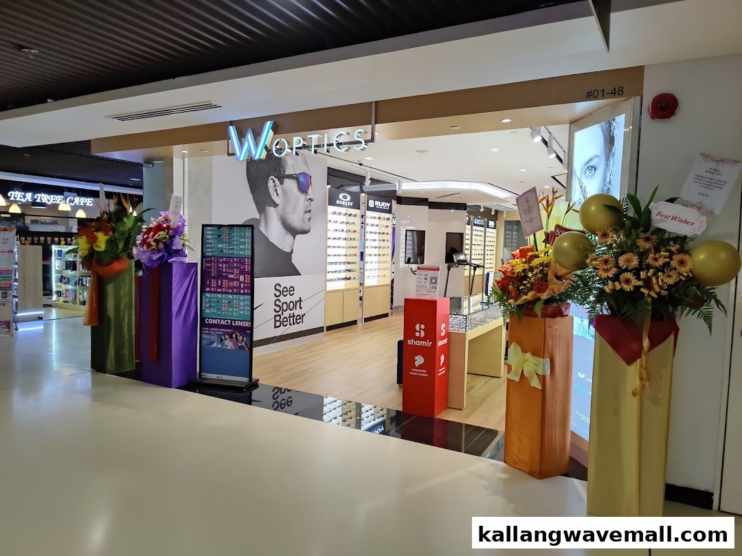 The shop front of W Optics, an eyewear store, featuring displays of glasses and promotional signage.