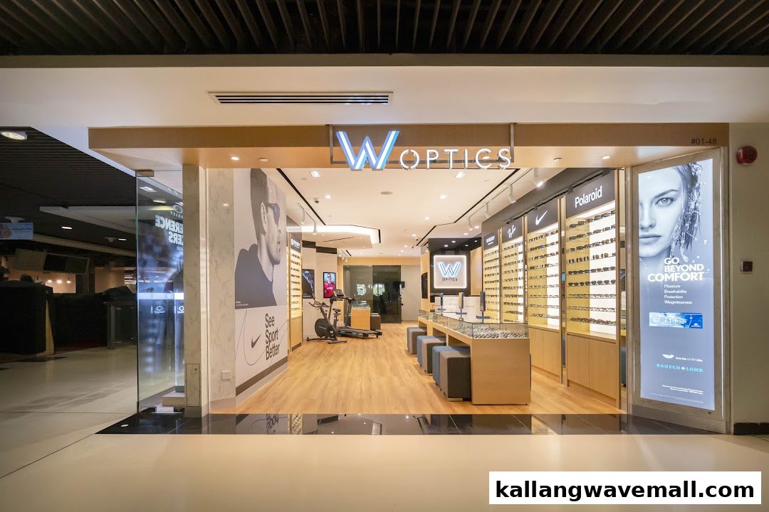 The brightly lit entrance of W Optics, showcasing a wide array of eyewear displays and a modern interior.