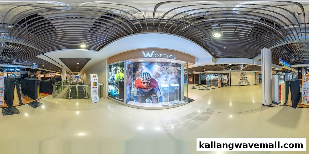 The shop front of W Optics features a large display with sports eyewear and a cyclist.