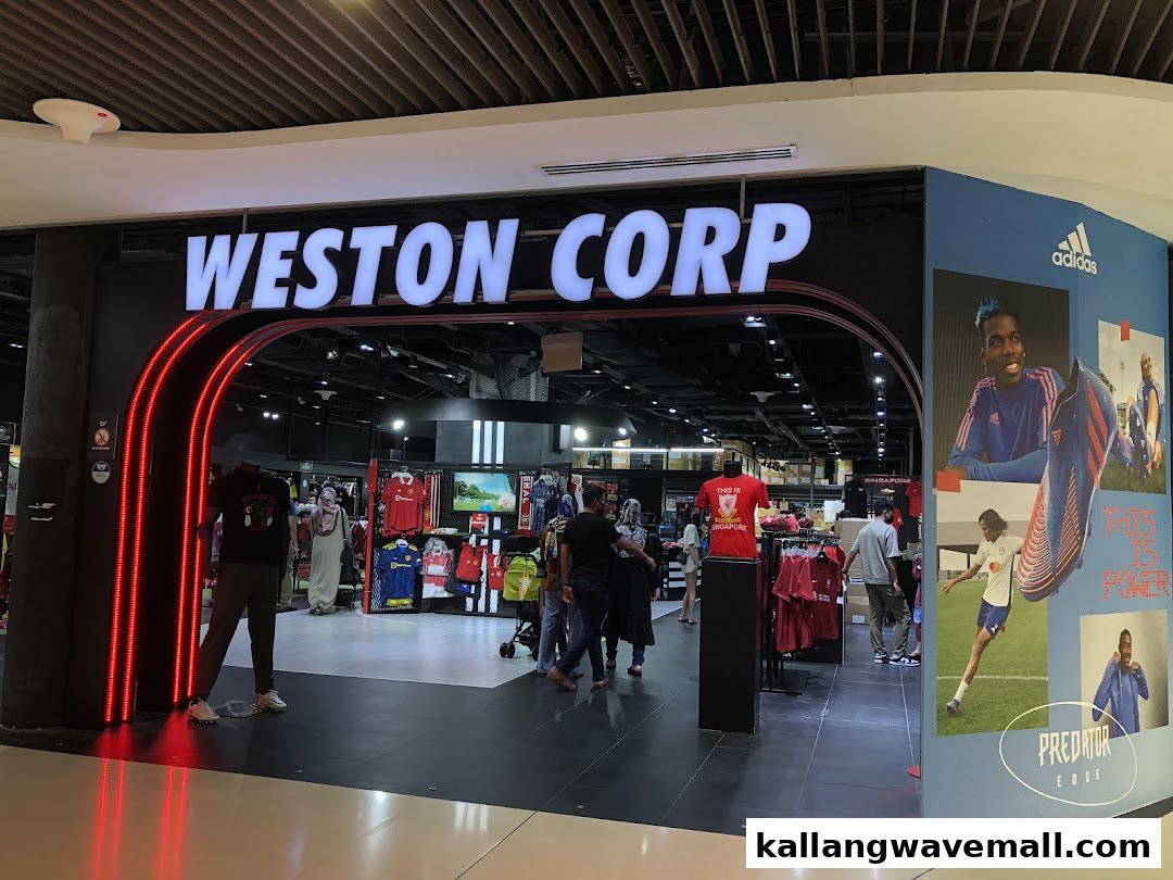 The brightly lit entrance of Weston Corp, a sports retail store, showcasing apparel and an Adidas display.