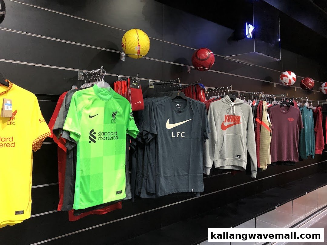 An interior view of Weston Corp, showcasing a wide range of Liverpool FC and Nike sports apparel and merchandise.