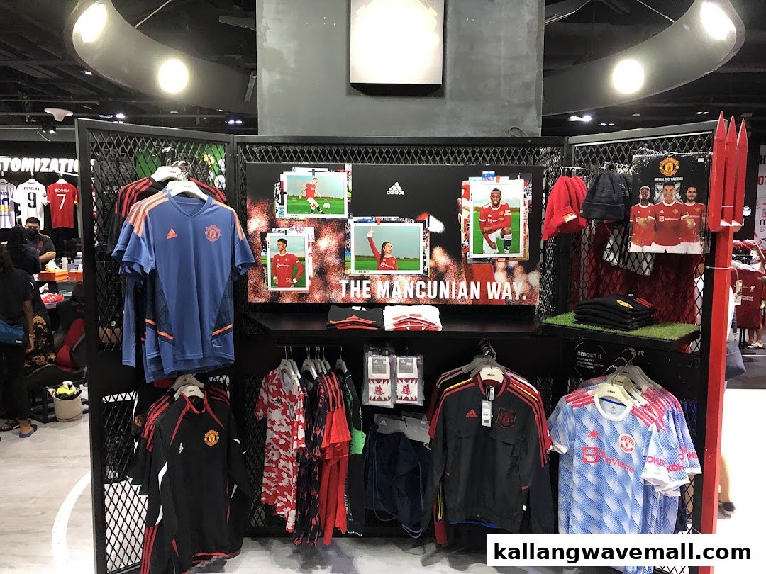 An interior shot of Weston Corp, showcasing a vibrant display of official Manchester United apparel and merchandise.
