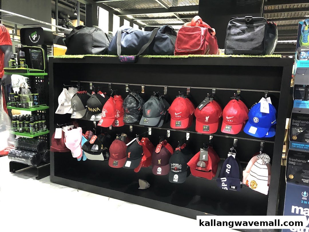 A retail display featuring a variety of sports caps, beanies, and bags, showcasing fan merchandise.