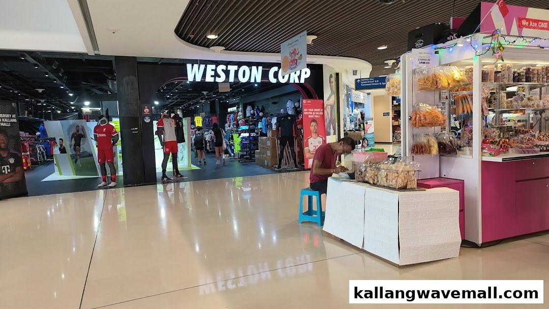 The entrance of Weston Corp, a sports apparel store, showcasing football jerseys on mannequins at Kallang Wave Mall.