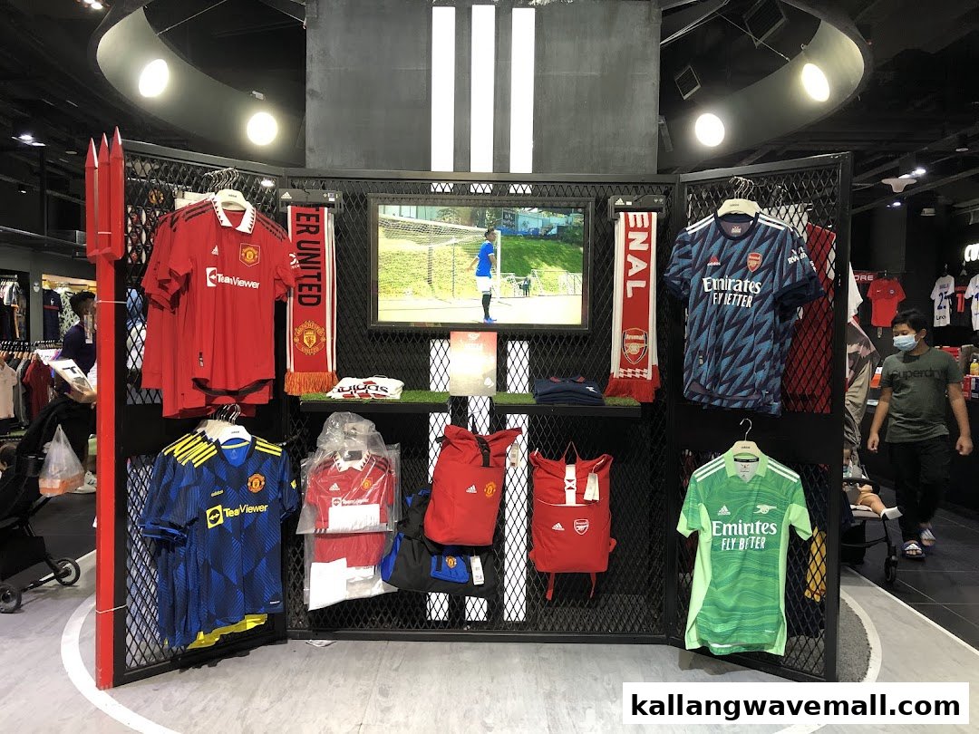 An interior view of Weston Corp showcasing official football club jerseys and fan merchandise on display.