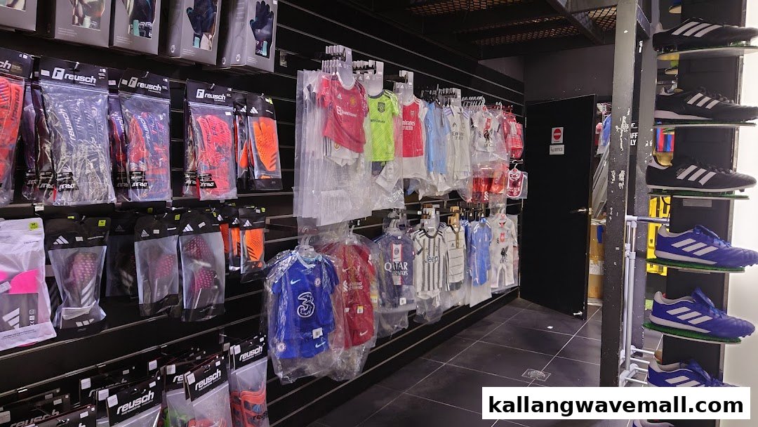 Interior view of Weston Corp, showcasing a wide range of football jerseys, goalkeeper gloves, and sports footwear.