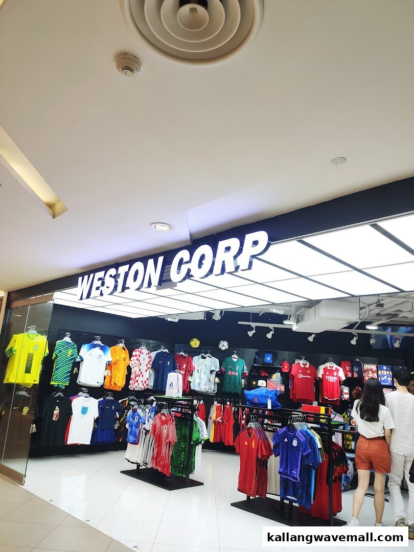 The brightly lit entrance of Weston Corp, a sports apparel store showcasing numerous football jerseys.