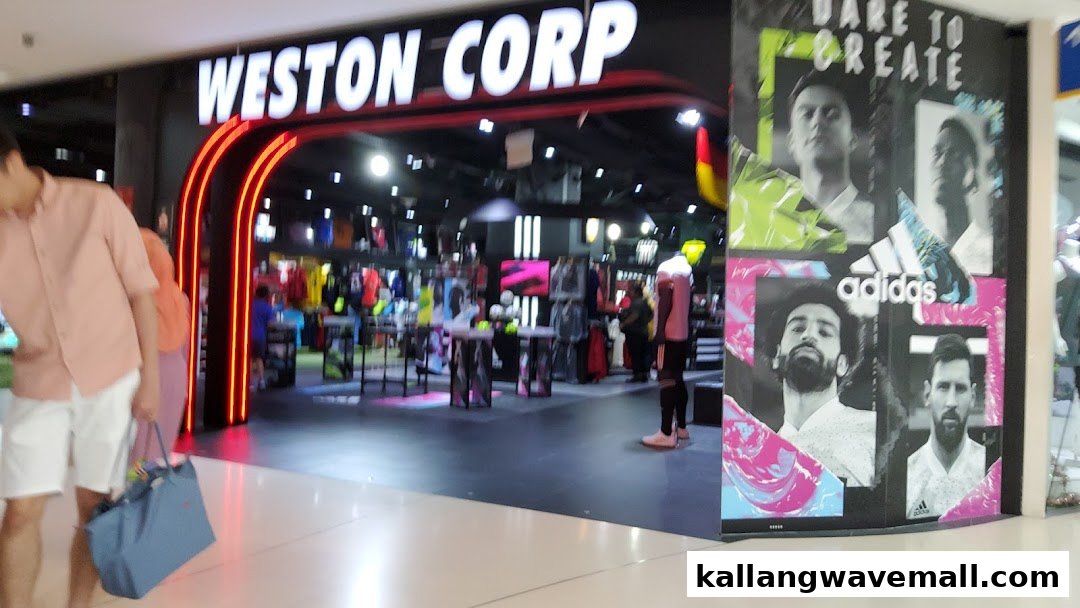 The brightly lit entrance of Weston Corp, a sports apparel store, with Adidas branding visible.