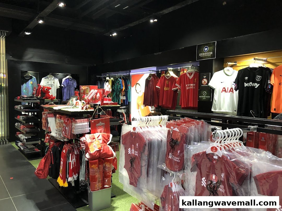 Interior view of Weston Corp, a sports merchandise store, displaying various football jerseys, apparel, and fan accessories.
