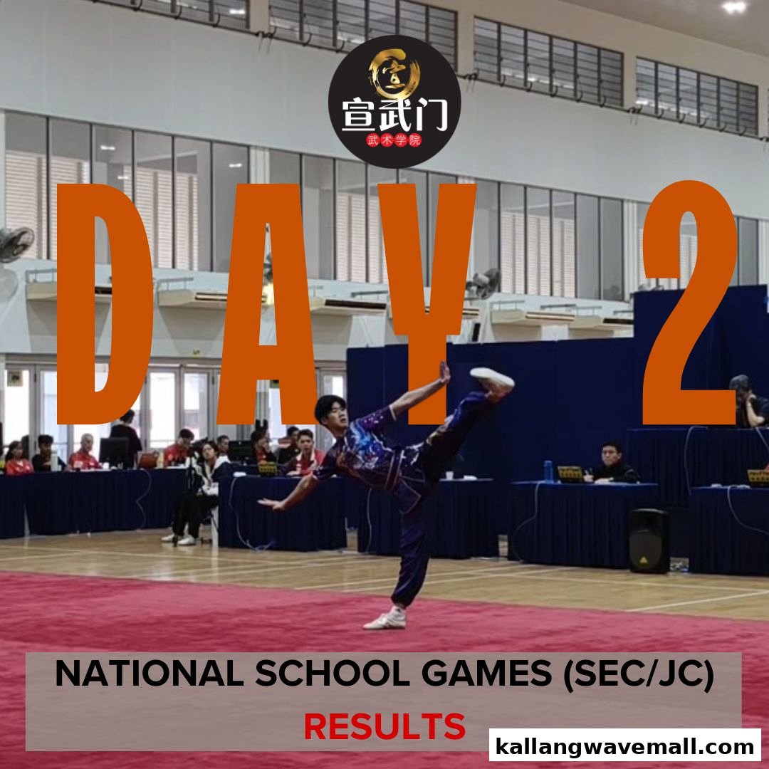 A martial artist performs a dynamic pose on a red mat during the National School Games, Day 2.