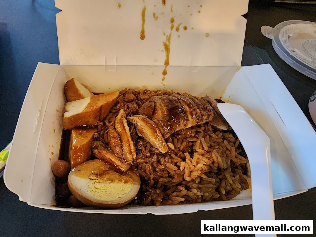 A delicious box of braised duck rice with egg, tofu, and fishcake from Yew Kee Specialities.