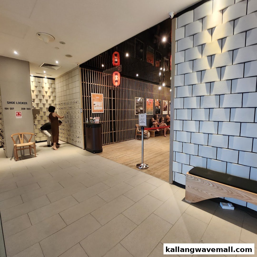 Interior view of Yunomori Onsen Spa's shoe locker and waiting area, featuring Japanese-inspired decor.