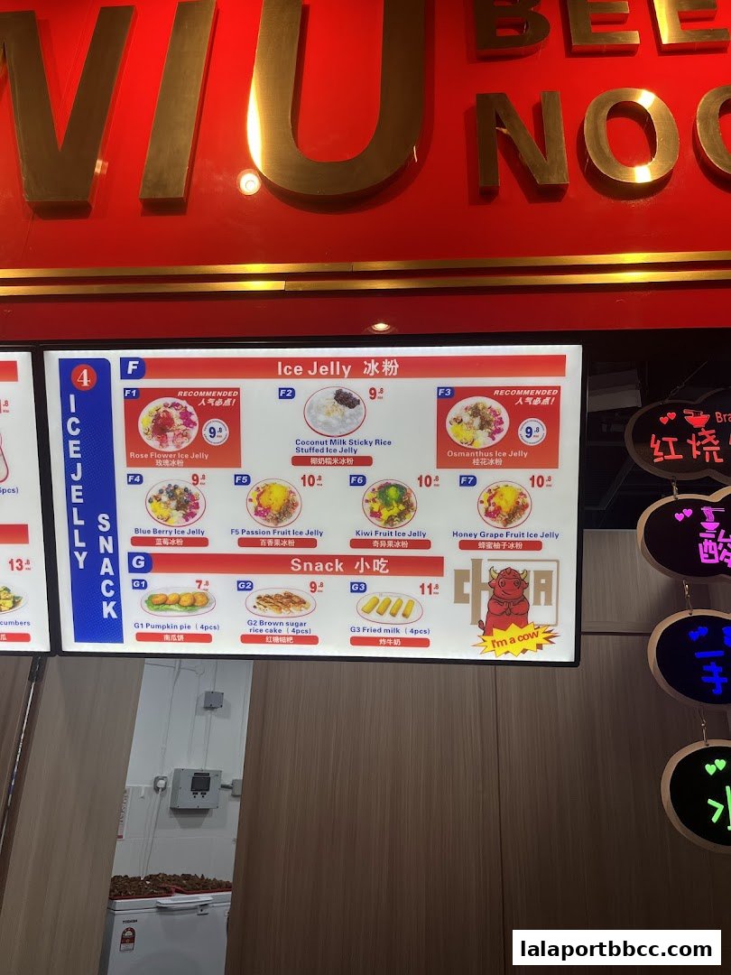 A menu board displays various ice jelly flavors and snacks with prices.