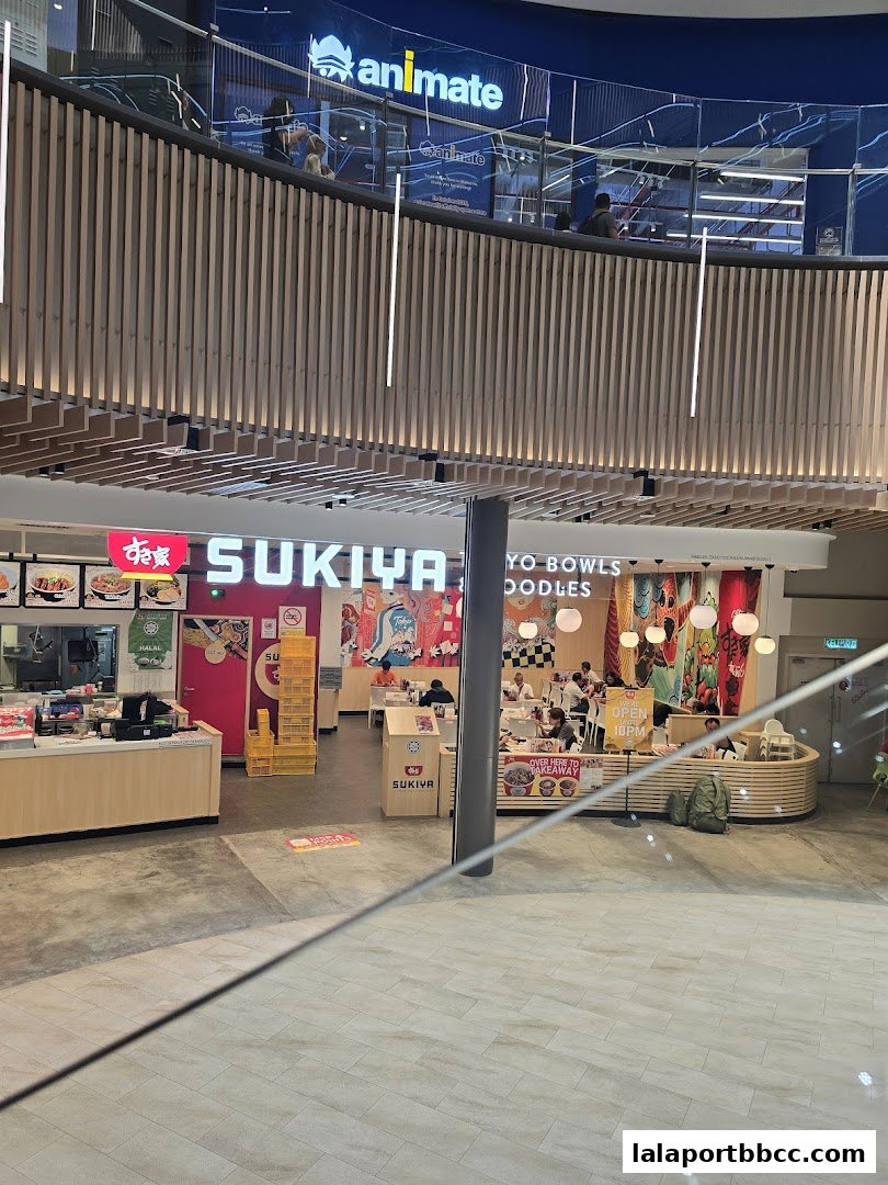 The Sukiya Tokyo Bowls & Noodles restaurant interior and exterior in a mall.