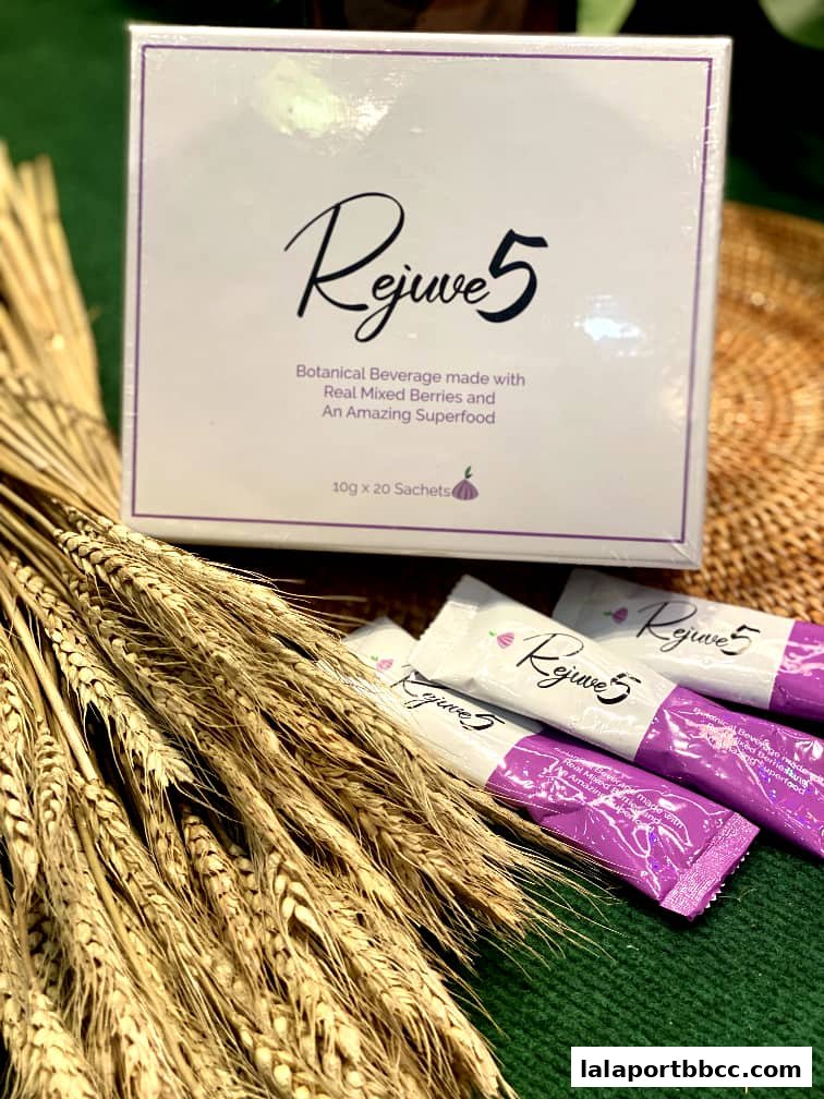 A box and sachets of Rejuve 5 botanical beverage with wheat stalks.