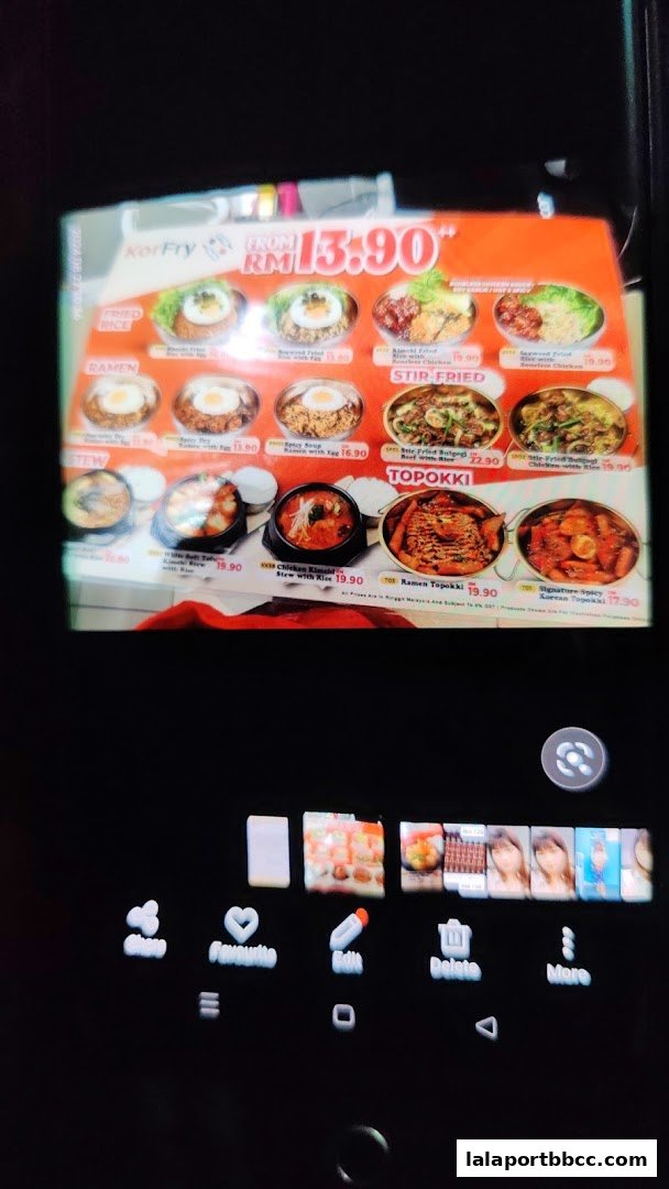 A menu from KorFry Lalaport BBCC KL featuring Korean dishes like ramen, stir-fried items, and topokki.