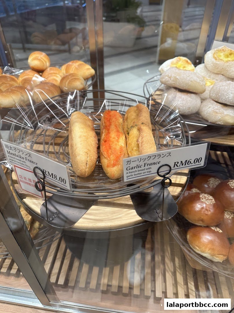 A display of freshly baked French bread with various toppings and fillings.