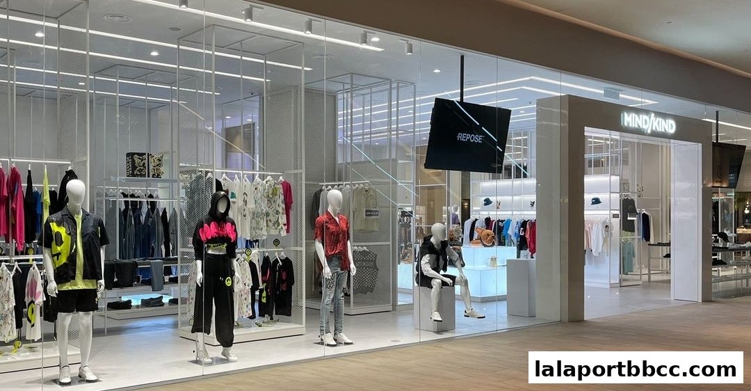 A modern retail store with mannequins displaying trendy clothing and a clean, minimalist interior.