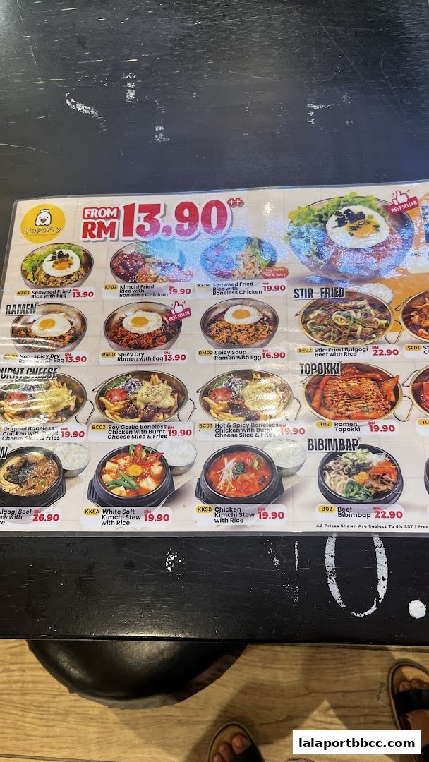 A menu from PapaFry Lalaport BBCC KL showcasing various Korean dishes with prices.