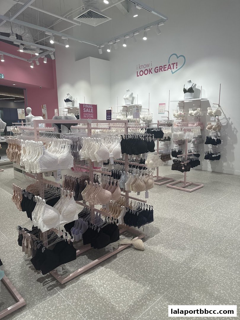 Interior view of a lingerie store displaying a wide selection of bras on racks.
