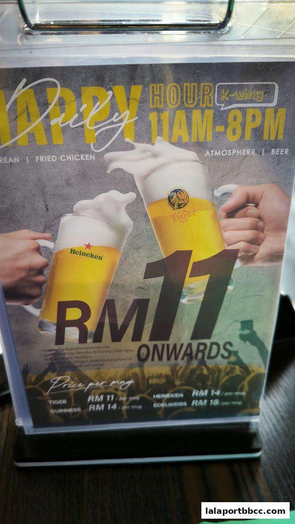 A menu board advertising happy hour with beer specials and prices.
