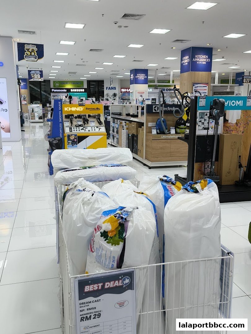 Interior view of a retail store showcasing various home appliances and electronics, with a special deal display in the foreground.