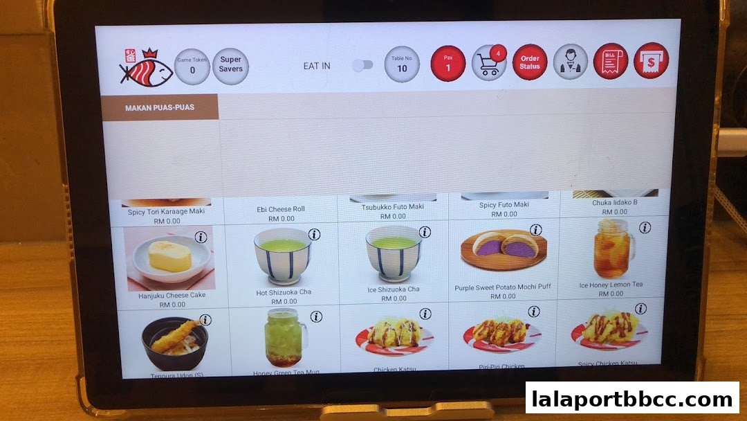 A tablet displaying a digital menu with various Japanese food items and drinks.