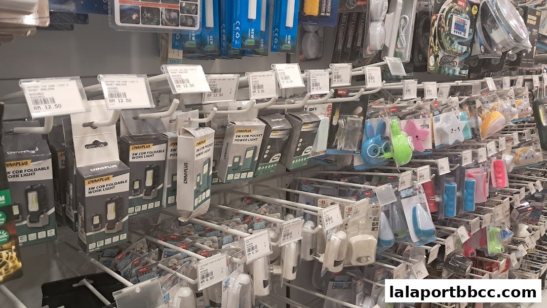 A retail display showcasing various lighting products, including work lights and decorative night lights.