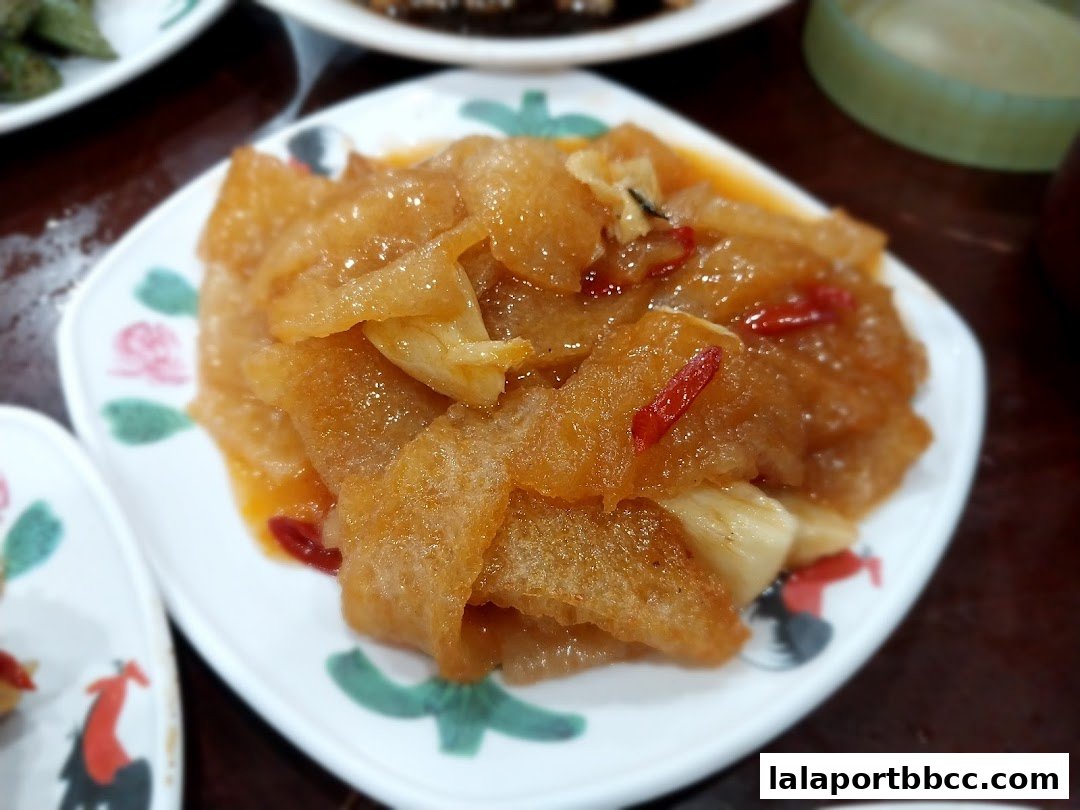 A close-up of a delicious Teochew dish served on a decorative plate.