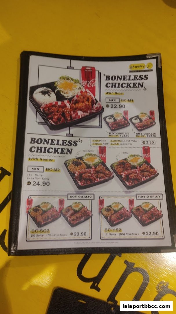 A menu from PapaFry showcasing boneless chicken meals with rice and ramen options.