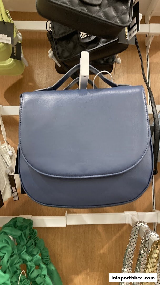 A display of various handbags and accessories at Forever 21.